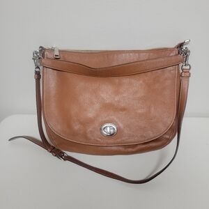 Coach Turnlock Pebbled Leather Hobo Bag.
